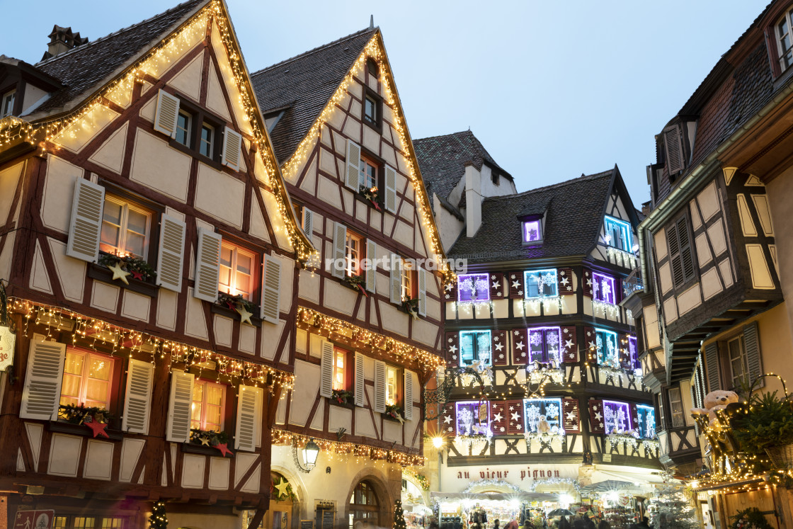 "Half-timbered old buildings illuminated with christmas decorations along the..." stock image