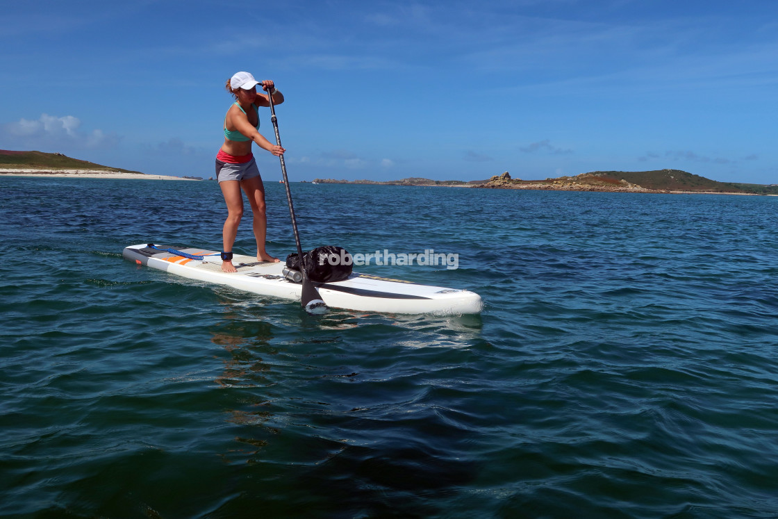 "Paddle boarder crossing from Bryher to St Mary's, Isles of Scilly" by robertharding - $62.60 "Paddle boarder crossing from Bryher to St Mary's, Isles of Scilly" stock image