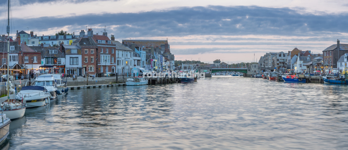 "View of boats in the Old Harbour and quayside houses at dusk, Weymouth,..." by robertharding - $62.31 "View of boats in the Old Harbour and quayside houses at dusk, Weymouth,..." stock image
