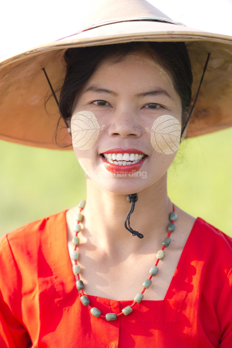 "Portrait of local woman wearing traditional bamboo hat, red dress and Thanaka..." by robertharding - $62.60 "Portrait of local woman wearing traditional bamboo hat, red dress and Thanaka..." stock image