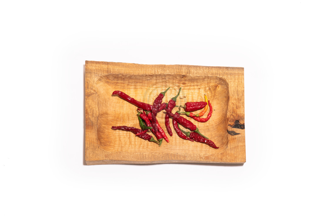 "Chilli peppers on a rough wooden tray" by Mister 360 - £15.00 "Chilli peppers on a rough wooden tray" stock image