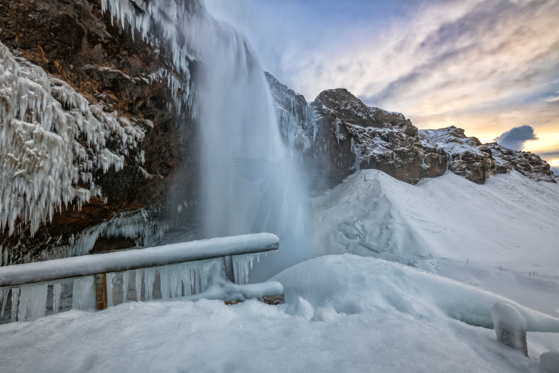 "Seljalandsfoss Winter Sunset" by Brian Krouskie - £15.00 "Seljalandsfoss Winter Sunset" stock image
