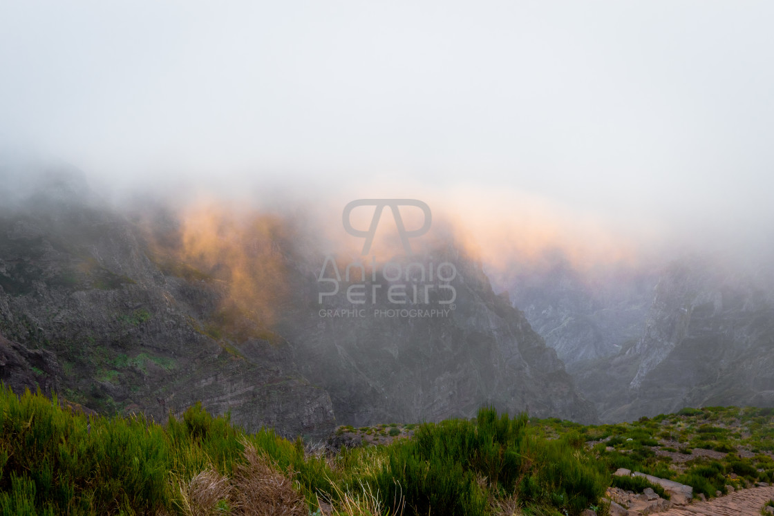 "Pico do Arieiro mountain peak at sunset with fog, Madeira Island, Portugal." stock image