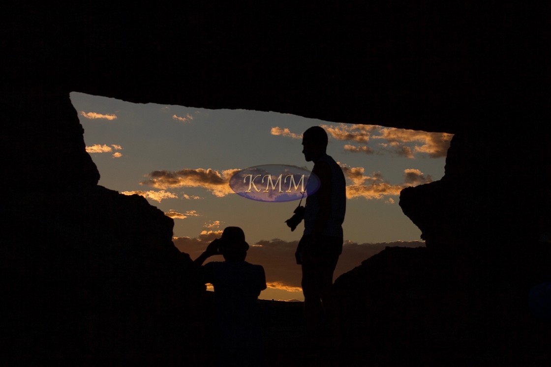 "Tourists in rock window, Isalo National Park, Madagascar" by KMM Visual Communications - £10.00 "Tourists in rock window, Isalo National Park, Madagascar" stock image