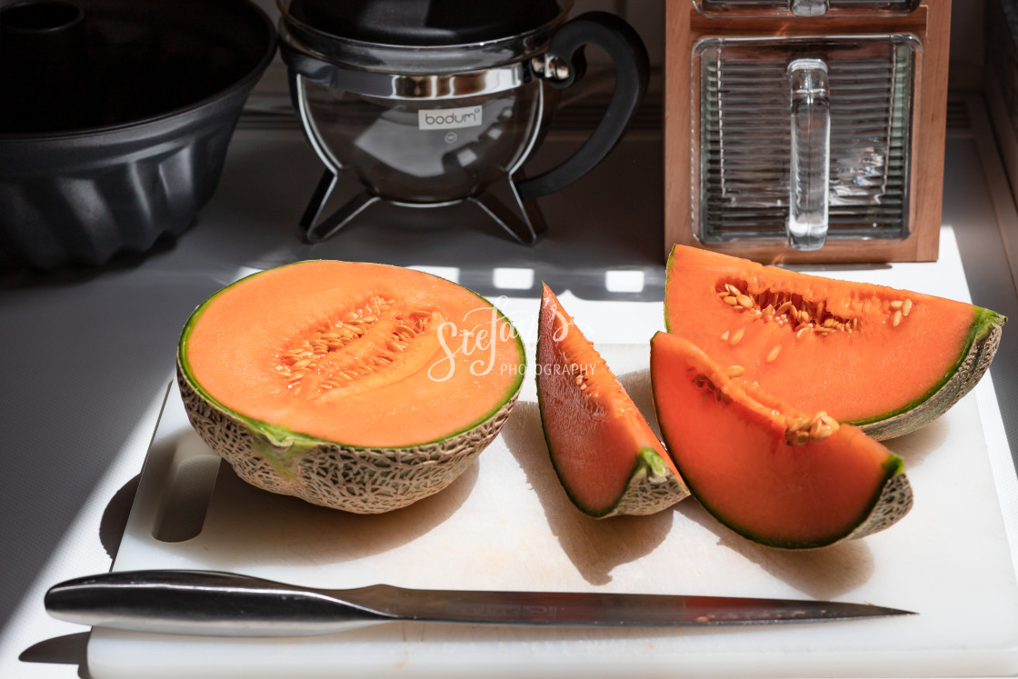 "Melon sliced on a white cutting board" by Stefan Schweihofer - £10.00 "Melon sliced on a white cutting board" stock image