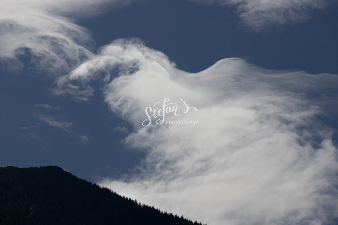 "Wispy Cloud Formations by the Tegernsee" by Stefan Schweihofer - £10.00 "Wispy Cloud Formations by the Tegernsee" stock image