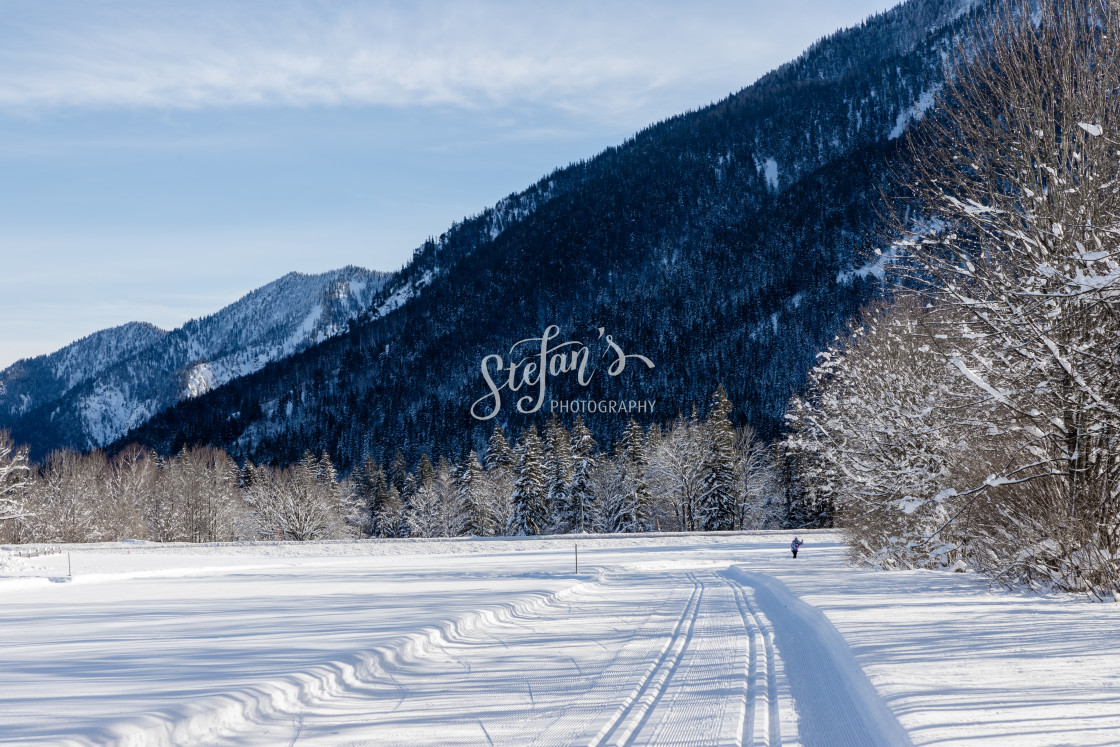"Cross-country ski trail with mountains" by Stefan Schweihofer - £10.00 "Cross-country ski trail with mountains" stock image