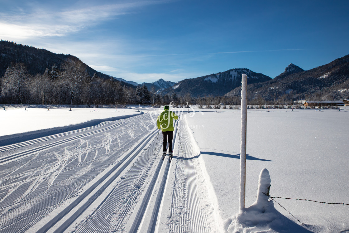 "Cross-country ski trail with mountains" by Stefan Schweihofer - £10.00 "Cross-country ski trail with mountains" stock image