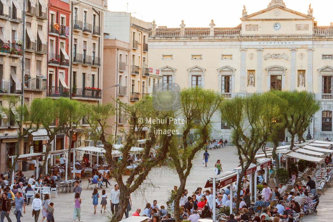 "Over looking the outdoor cafes and town hall in Plaza de la Font" by Mehul Patel - $24.87 "Over looking the outdoor cafes and town hall in Plaza de la Font" stock image