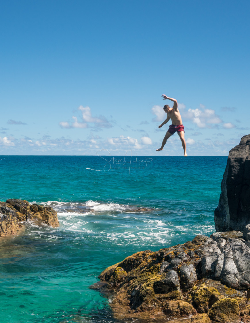 "Fit young man jumps into ocean at Lumahai beach Kauai" by Steve Heap - $8.21 "Fit young man jumps into ocean at Lumahai beach Kauai" stock image