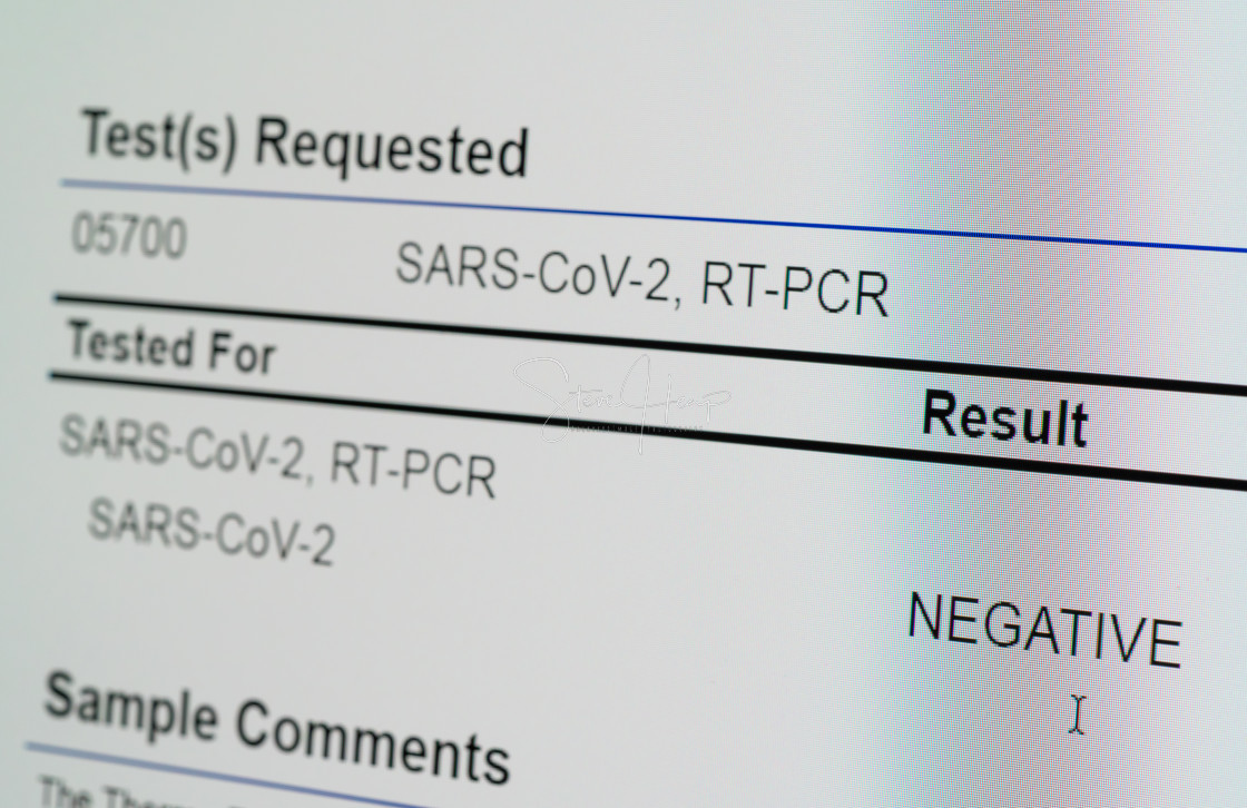 "View of computer screen showing result of PCR test for Covid-19 as negative" stock image