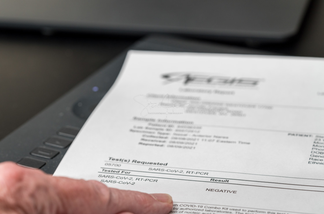 "Printout showing result of PCR test for Covid-19 as negative" stock image