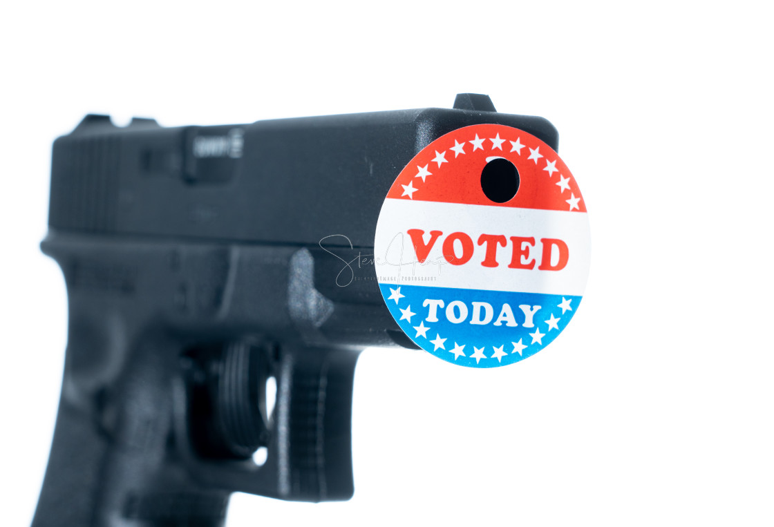 "I voted today campaign button with hole on handgun for voter suppression" stock image