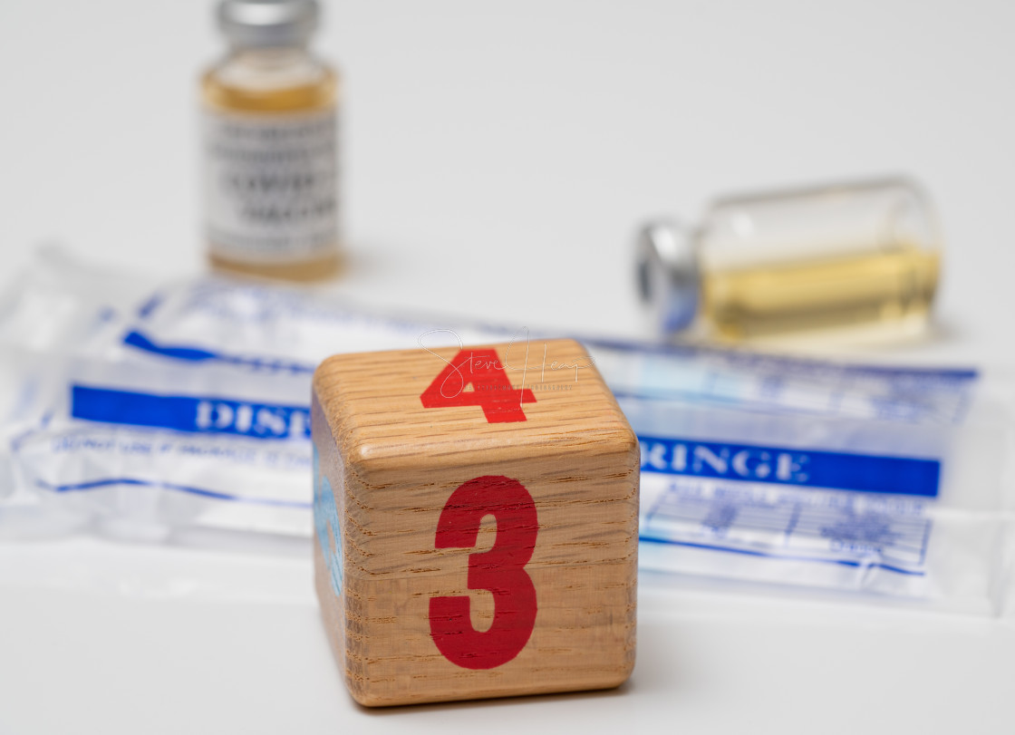 "Concept for Covid-19 booster dose or shot using wooden three block with..." stock image