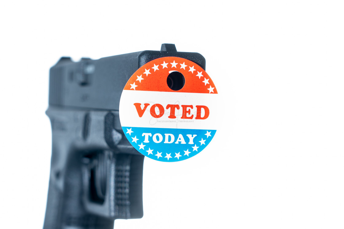 "I voted today campaign button with hole on handgun for voter suppression" stock image