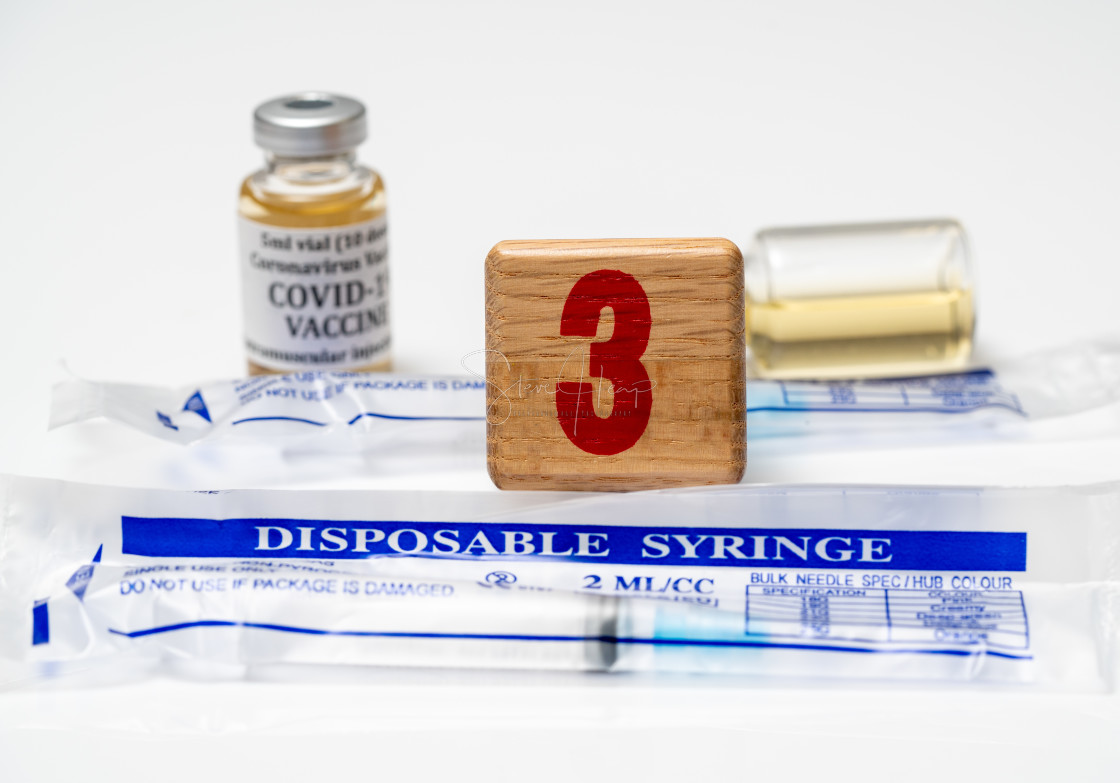 "Concept for Covid-19 booster dose or shot using wooden three block with..." stock image