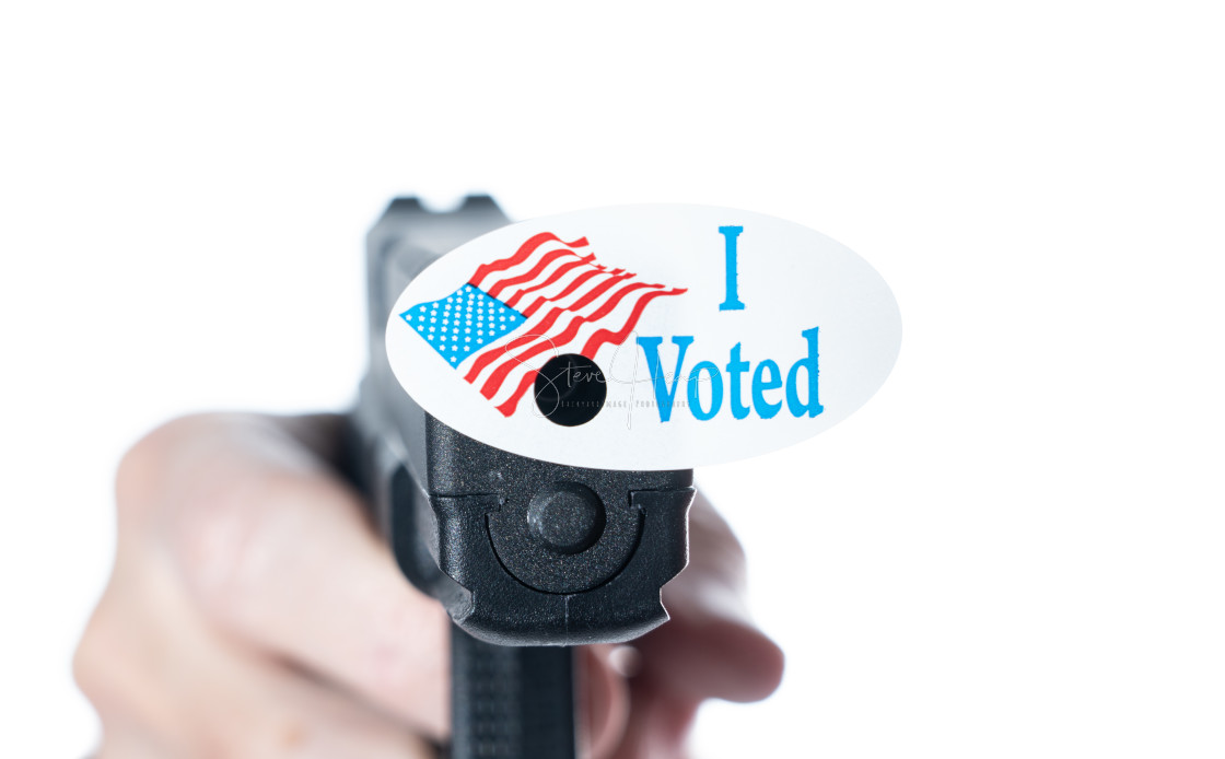 "I voted today campaign button with hole on handgun for voter suppression" stock image