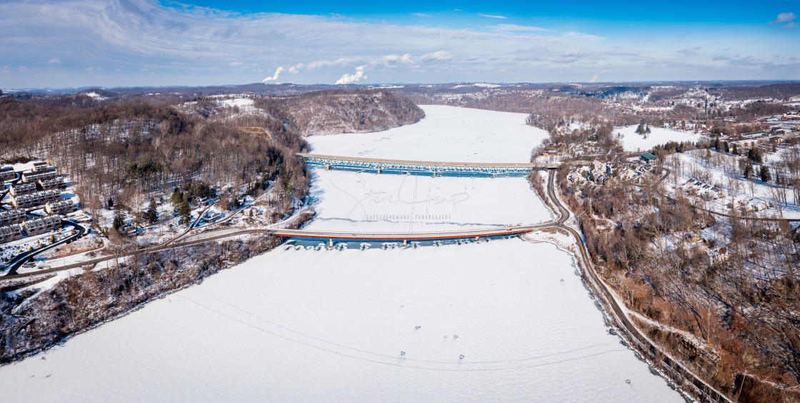 "Aerial panorama of the frozen Cheat Lake Morgantown, WV with I68 bridge" stock image