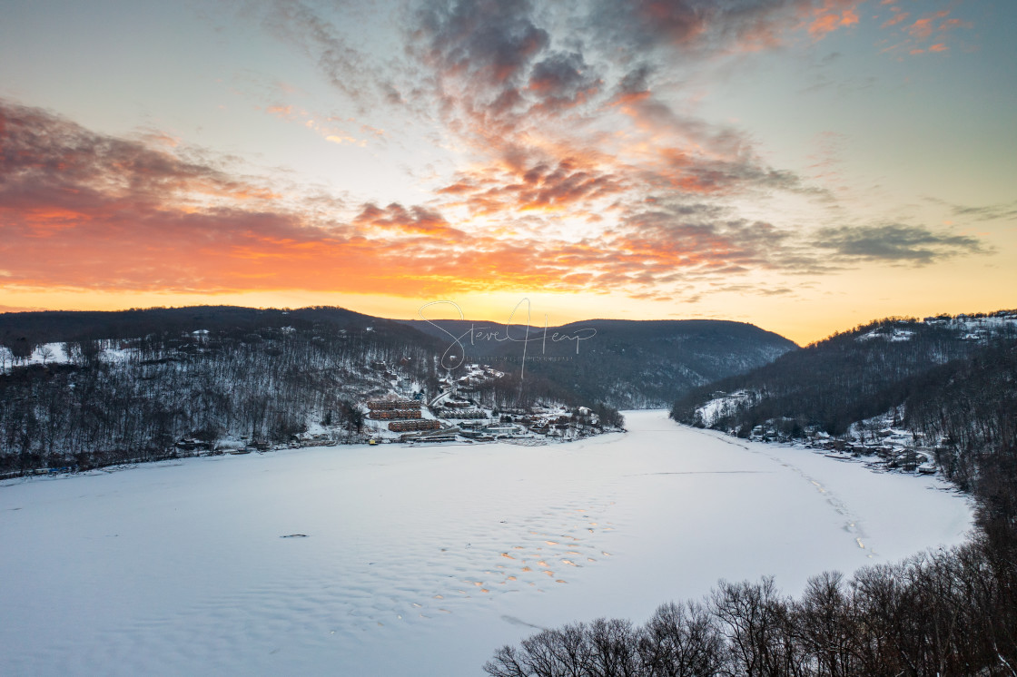 "Aerial sunrise over frozen Cheat Lake Morgantown, WV" stock image