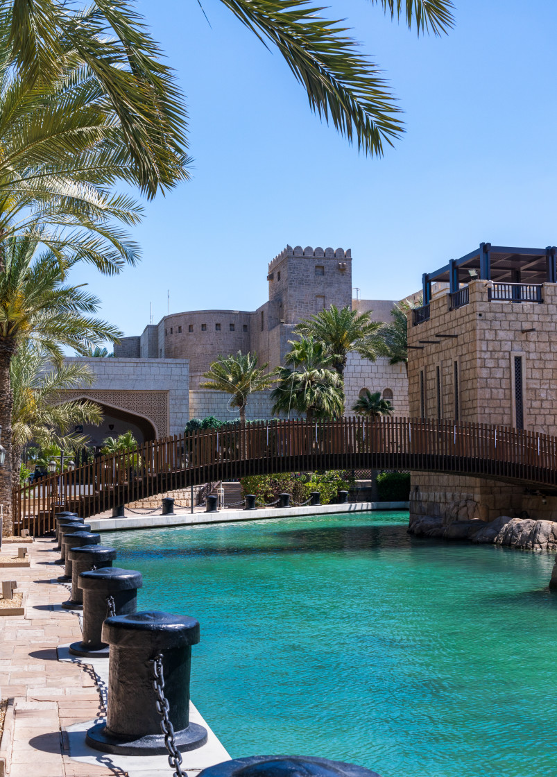 "Wooden bridge over waterway in Souk Madinat Junction mall" stock image