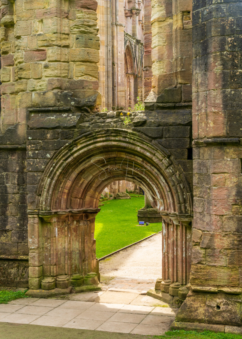 "Entrance arch to Fountains Abbey ruins in Yorkshire, England" stock image