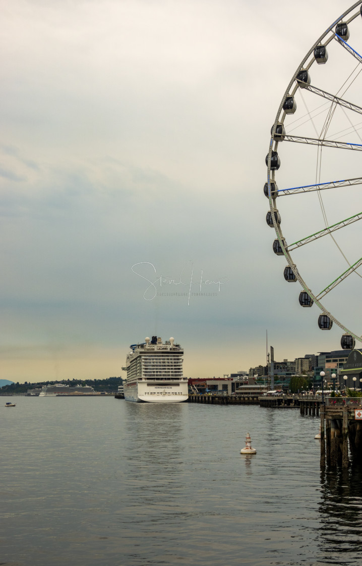 "Norwegian Bliss cruise ship docked by Great Wheel in Seattle" by Steve Heap - $8.21 "Norwegian Bliss cruise ship docked by Great Wheel in Seattle" stock image