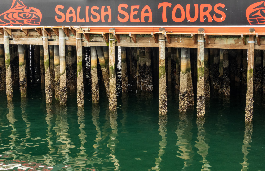 "Salish Sea Tours on ancient pier pilings in Seattle Washington" by Steve Heap - $8.21 "Salish Sea Tours on ancient pier pilings in Seattle Washington" stock image
