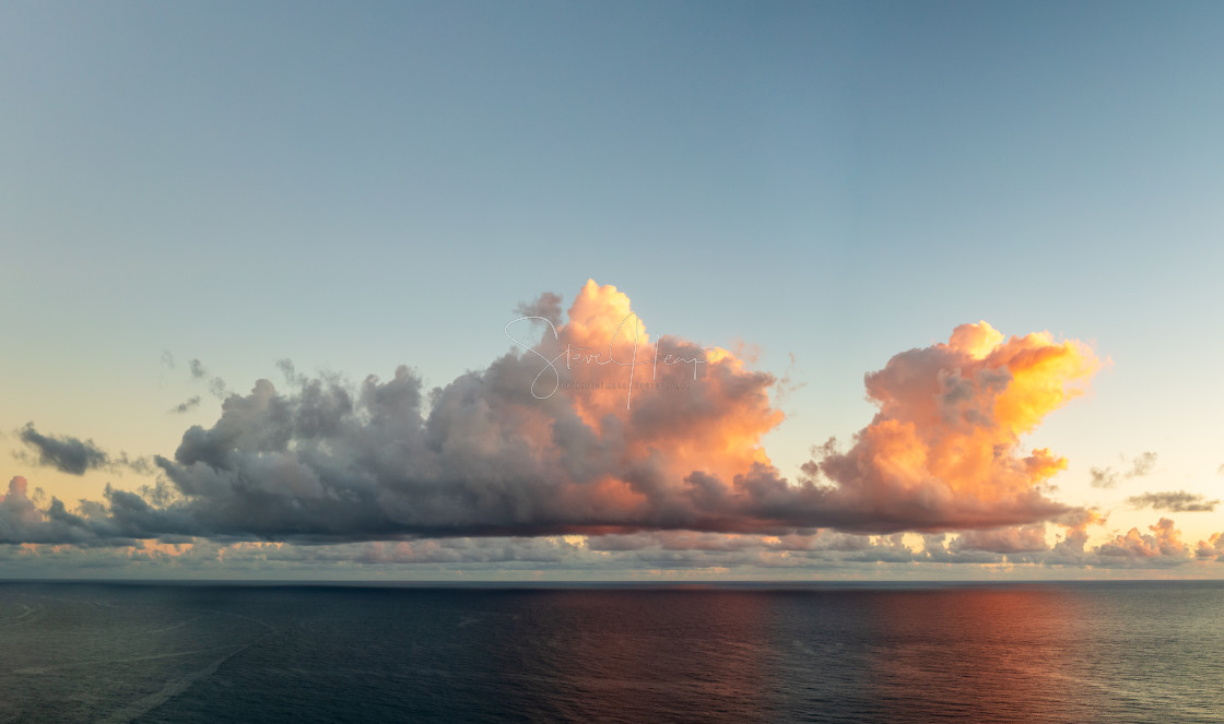 "Panorama of sunlit cumulus clouds over ocean horizon on Kauai" by Steve Heap - $8.21 "Panorama of sunlit cumulus clouds over ocean horizon on Kauai" stock image