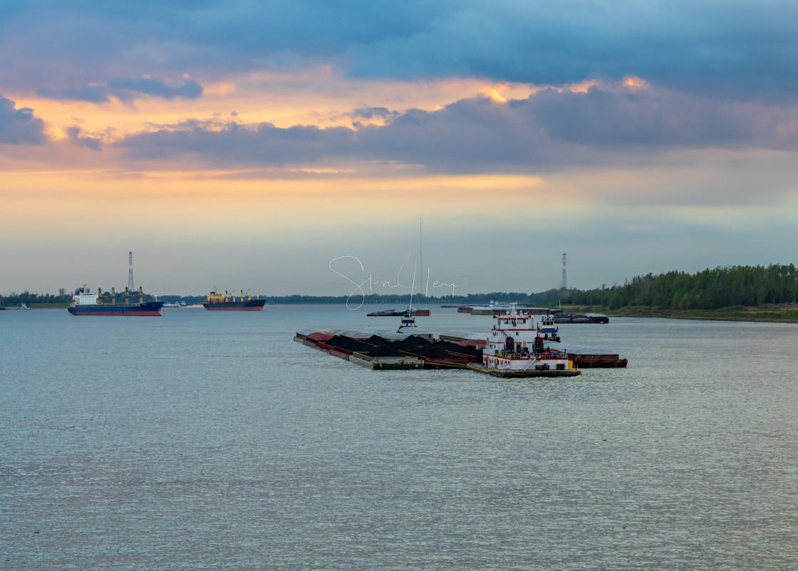 "Sunset over the coal barge in Baton Rouge, Louisiana" stock image