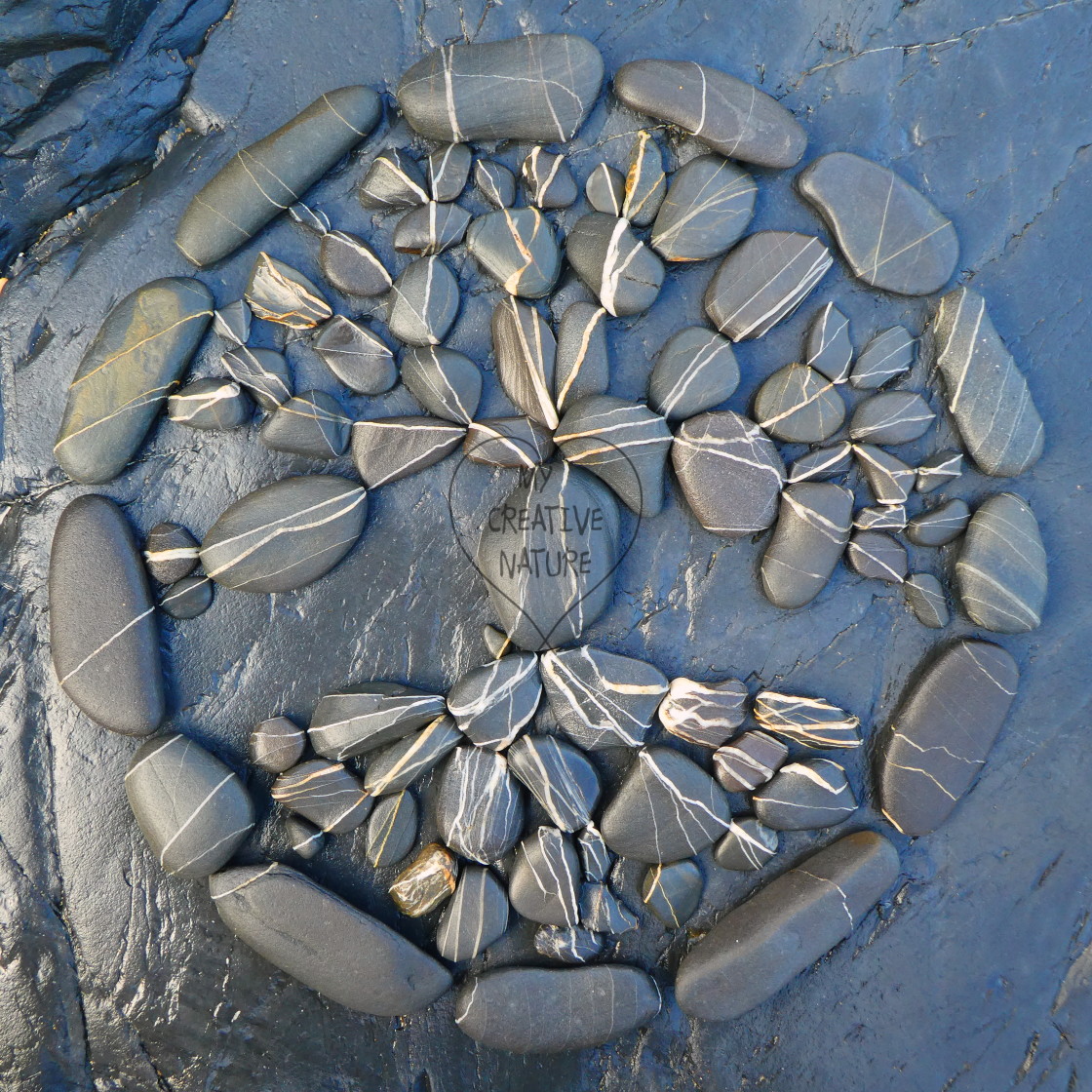 "tree of life from beach pebbles" stock image