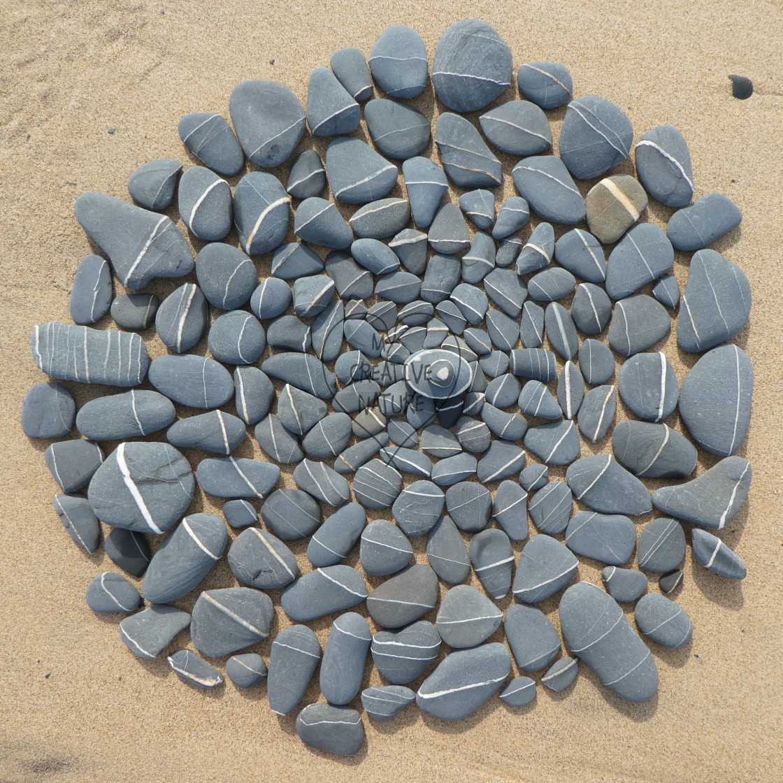 "stone circles from beach pebbles" by Lucia Pec - £10.00 "stone circles from beach pebbles" stock image