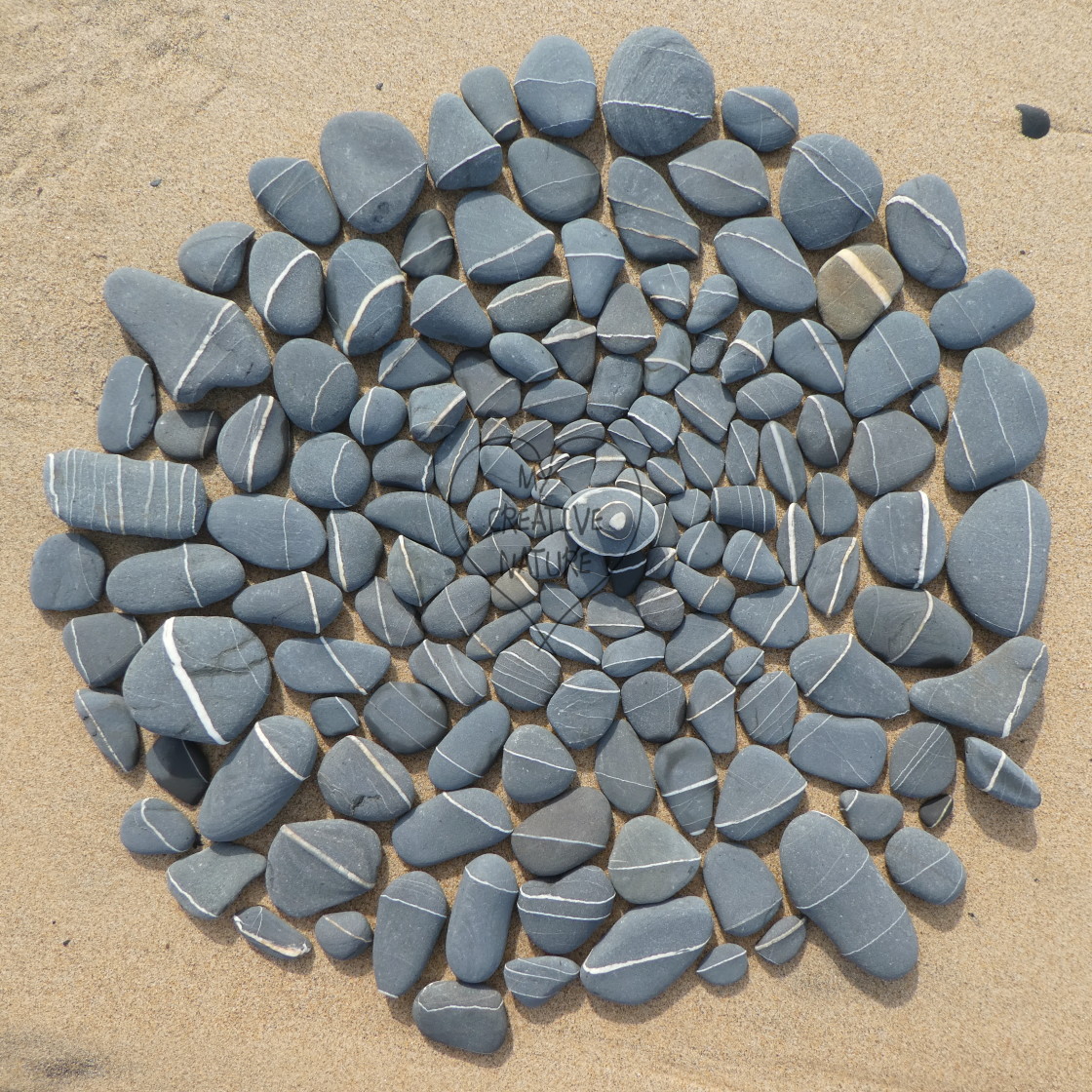 "stone circles from beach pebbles" stock image