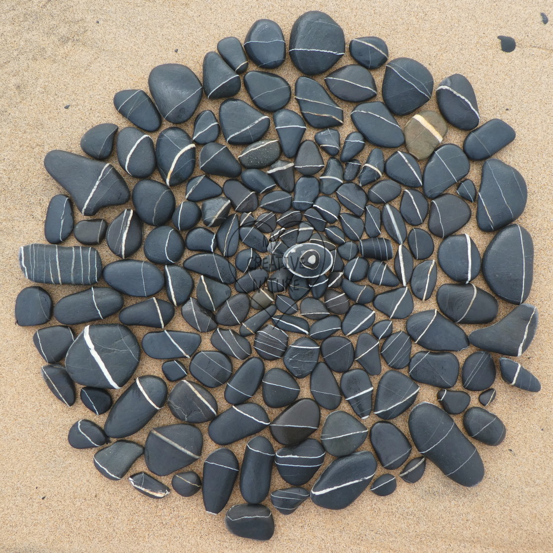 "stone circles from beach pebbles" by Lucia Pec - £10.00 "stone circles from beach pebbles" stock image
