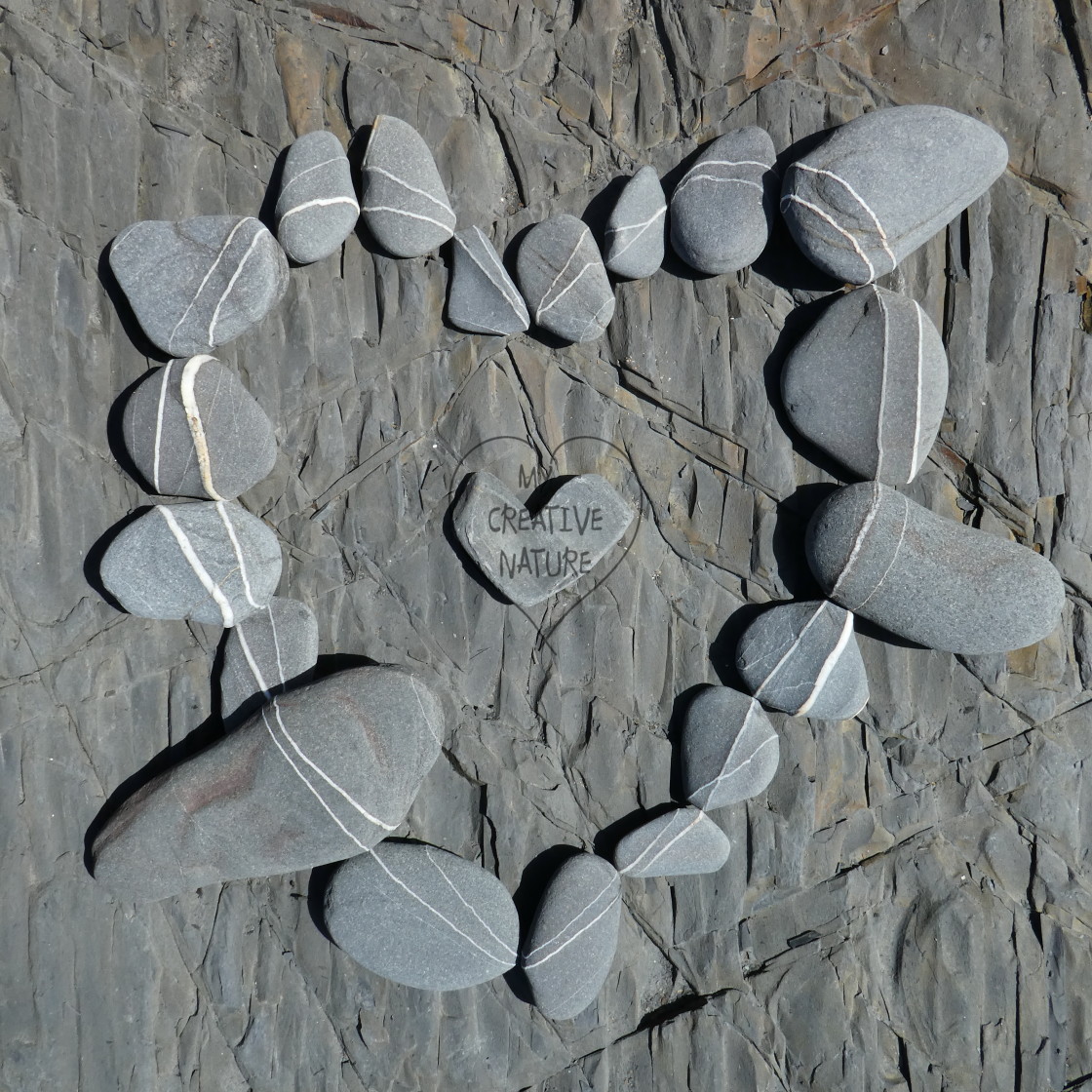 "beach pebble heart print" stock image