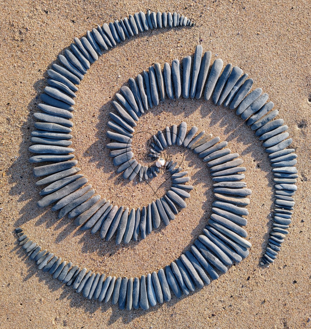 "Triple spiral of beach stones in Portugal" stock image