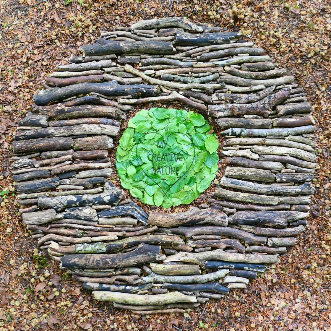 "Landart creation from beech sticks and leaves" stock image