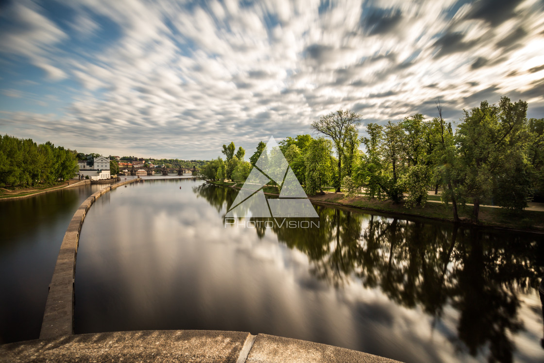 "Cloud and tree reflection on the river in Prague" stock image