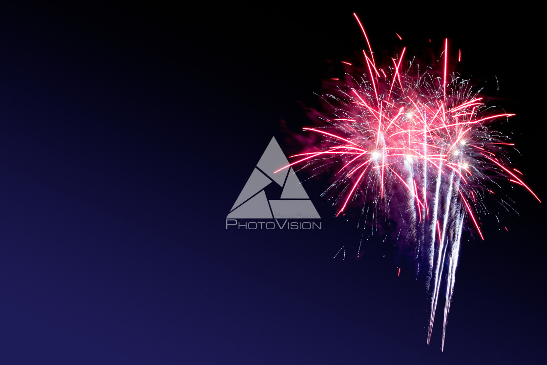 "Colorful firework on the night sky. New Year celebration fireworks. Abstract firework isolated on black background with free space for text" stock image