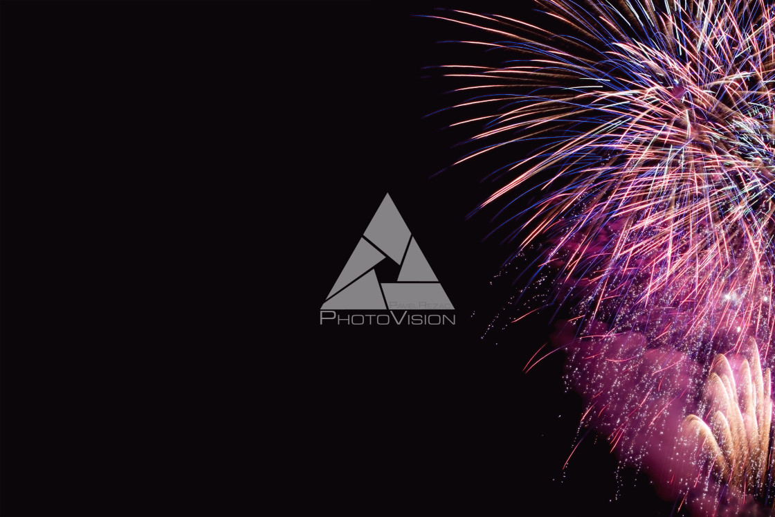 "Colorful firework on the night sky. New Year celebration fireworks. Abstract firework isolated on black background with free space for text" stock image