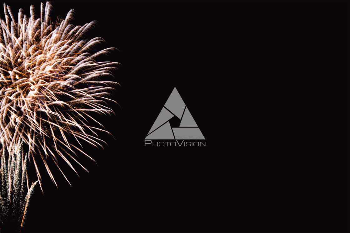 "Colorful firework on the night sky. New Year celebration fireworks. Abstract firework isolated on black background with free space for text" stock image