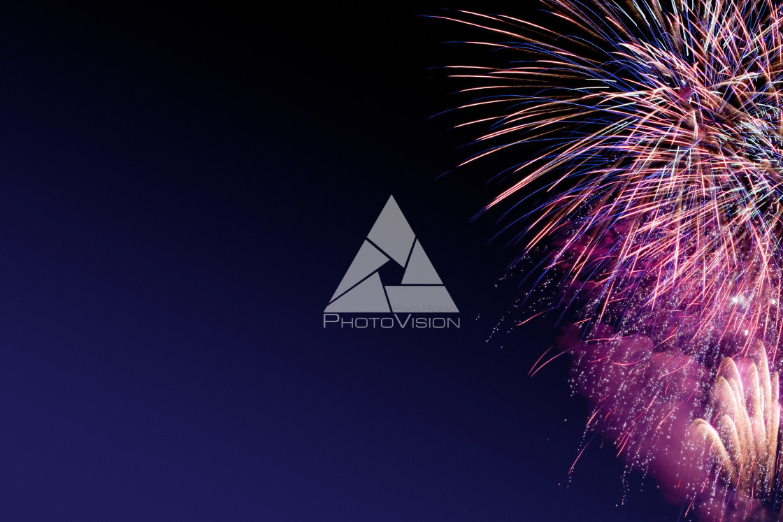 "Colorful firework on the night sky. New Year celebration fireworks. Abstract firework isolated on black background with free space for text" stock image