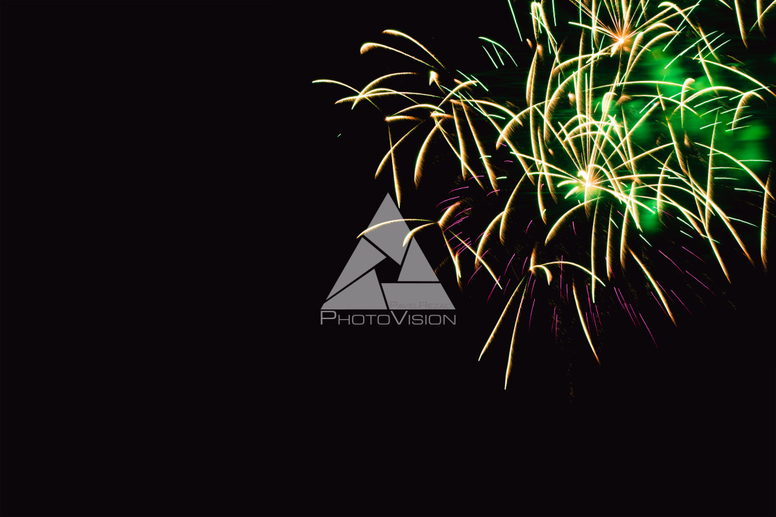 "Colorful firework on the night sky. New Year celebration fireworks. Abstract firework isolated on black background with free space for text" stock image