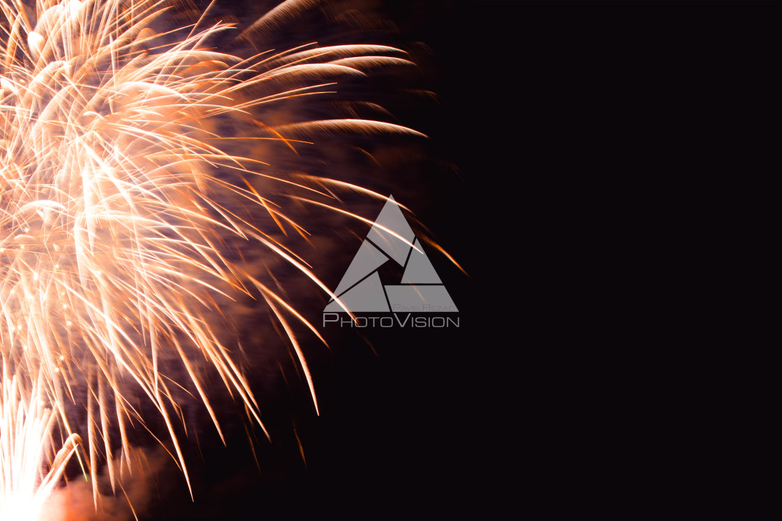 "Colorful firework on the night sky. New Year celebration fireworks. Abstract firework isolated on black background with free space for text" stock image