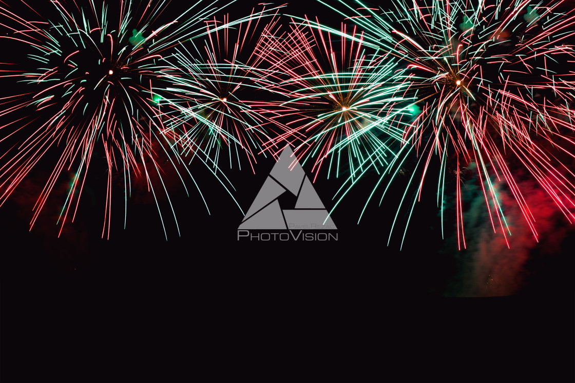 "Colorful firework on the night sky. New Year celebration fireworks. Abstract firework isolated on black background with free space for text" stock image