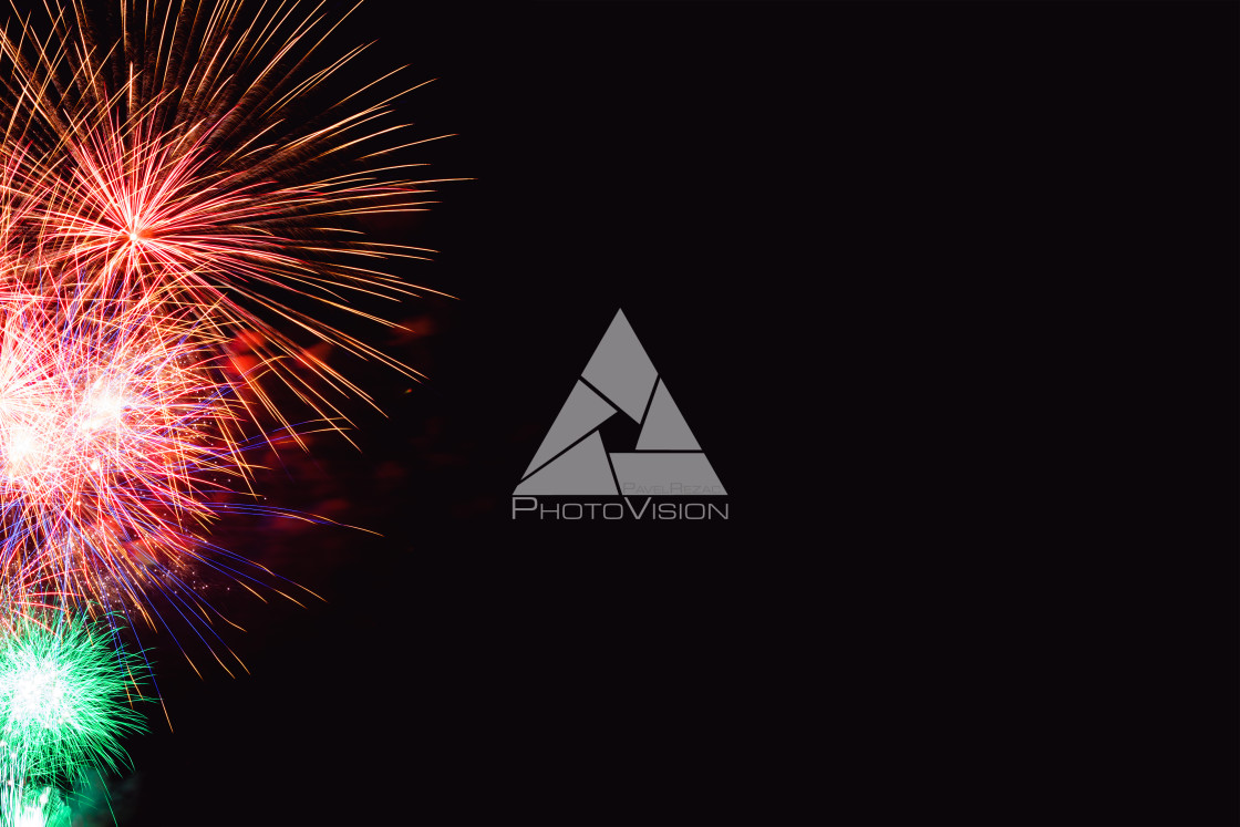 "Colorful firework on the night sky. New Year celebration fireworks. Abstract firework isolated on black background with free space for text" stock image