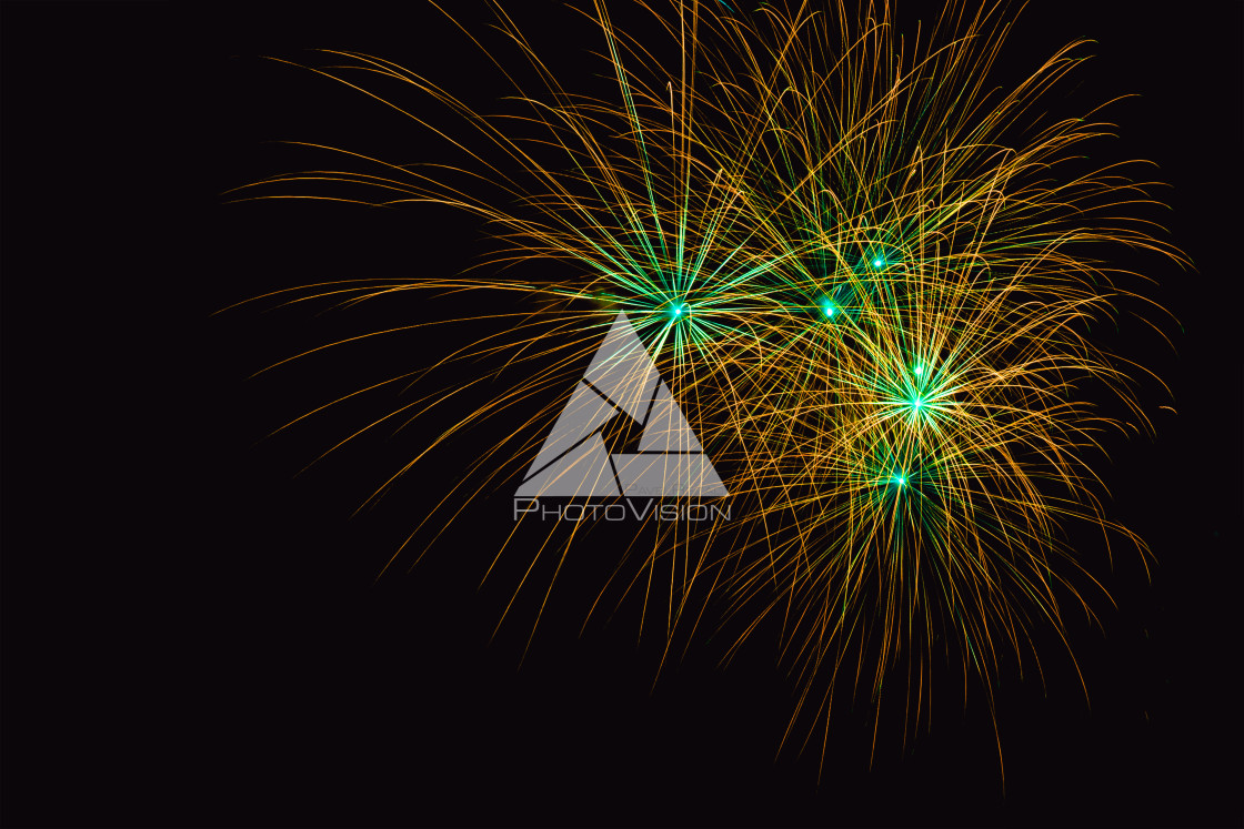 "Colorful firework on the night sky. New Year celebration fireworks. Abstract firework isolated on black background with free space for text" stock image