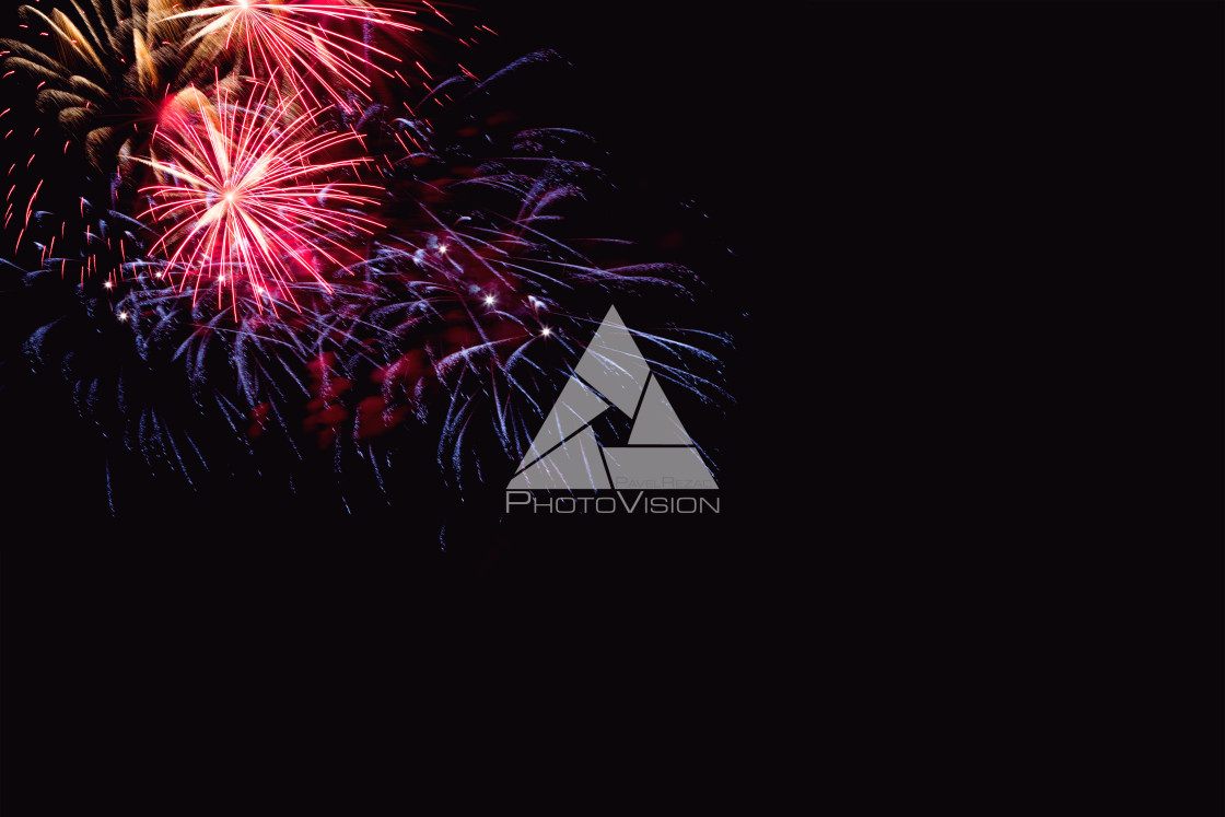 "Colorful firework on the night sky. New Year celebration fireworks. Abstract firework isolated on black background with free space for text" stock image