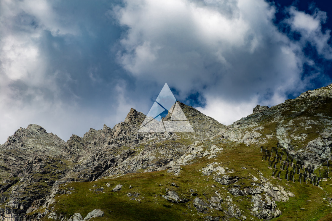 "Summer sky with clouds over alpine peaks" stock image