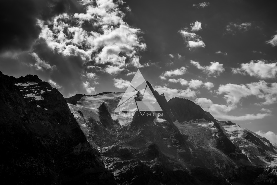 "Dramatic sky in a valley with a mountain Grossglockner" stock image