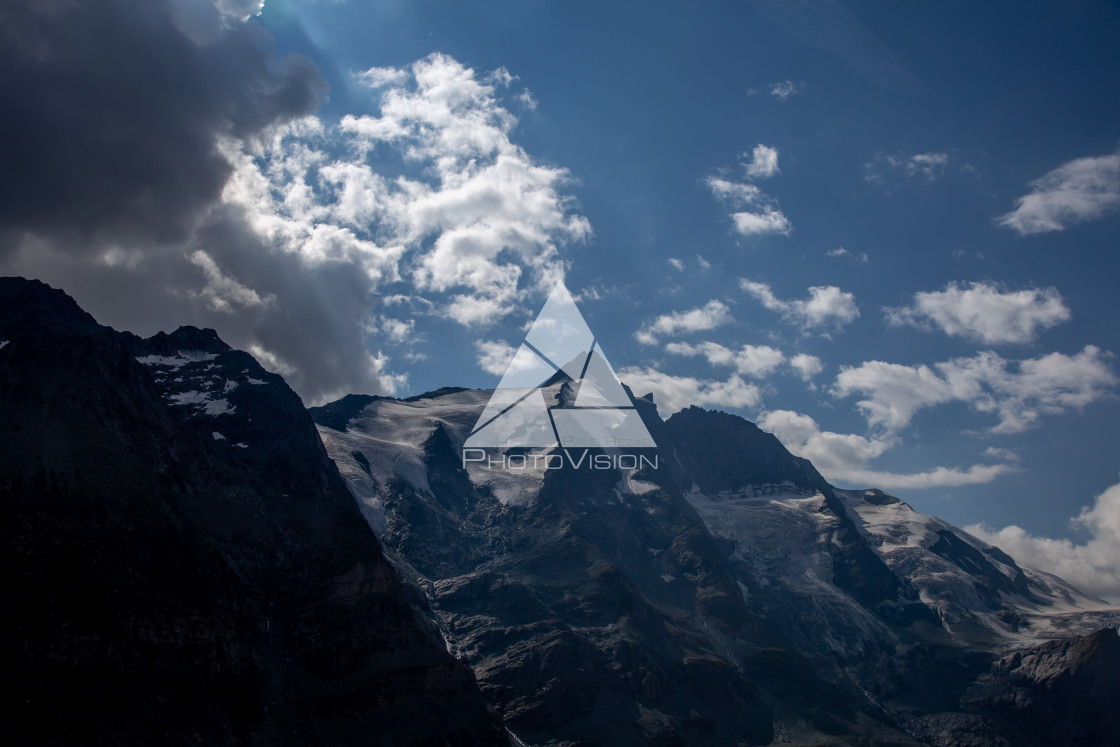 "Dramatic sky in a valley with a mountain Grossglockner" stock image